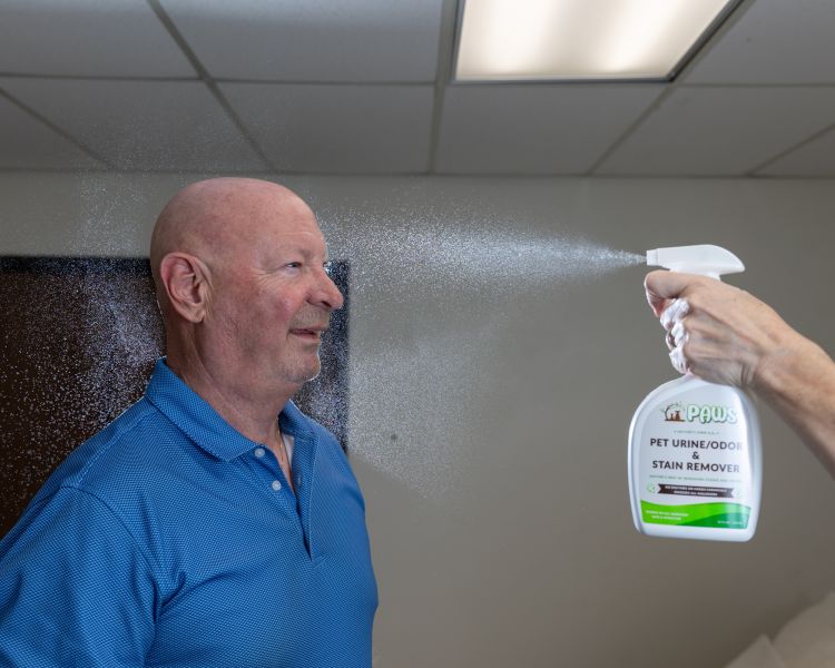 Owner of PAWS, Lee, sprayed in the face with bottle of Pet Urine/Odor and Stain Remover